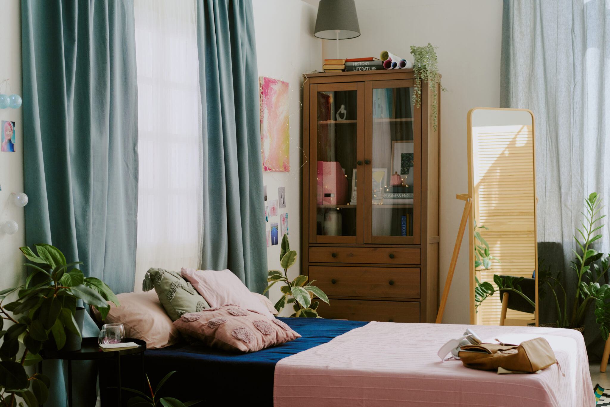 About Us 1 cozy sunlit bedroom with houseplants and bookshelf 2025 02 11 12 57 28 utc 2048x1365 1